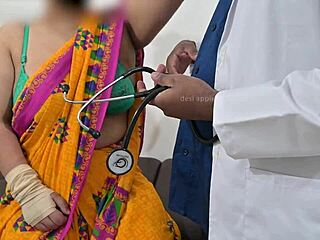 The doctor is checking the telugu aunty's boobs in the hospital with the nurse watching this indian patient scene.
