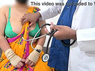 The doctor is checking the telugu aunty's boobs in the hospital with the nurse watching this indian patient scene.