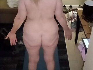 Mature MILF does naked yoga with big natural tits.