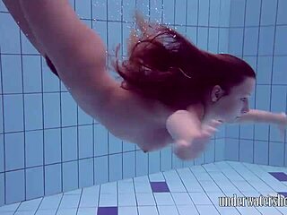 Lucy strips off bikini in pool underwater