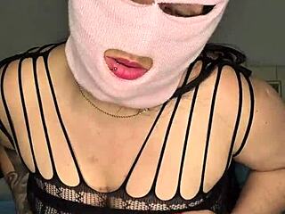 Masked babe with big tits pounds her pussy intensely