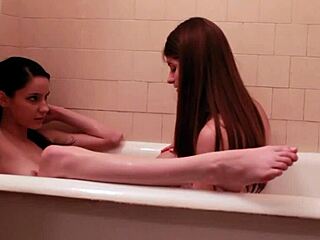 in the hotel bath, these two lesbians got busy licking and masturbating each other.