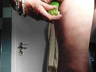 German granny intensely fucks pussy with cucumber
