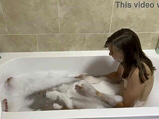 Brunette mature sings naked in steamy bathroom bath