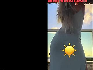 hot blonde dances seductively in sheer see-through dress