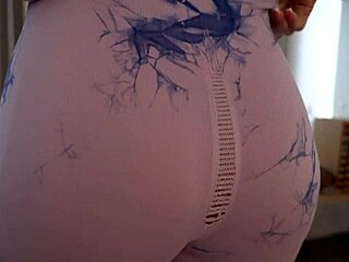 stepsis in ripped leggings dances happily during intense workout session