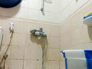 Chubby Asian busty beauty fingers tits in shower