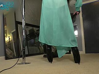 Brunette housewife vacuums in sexy hobble boots and heels
