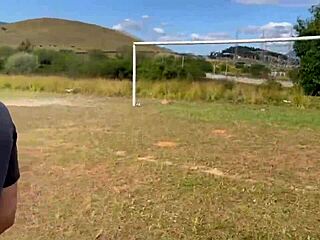 Horny wife strokes fat cock naked in field then offers ass on soccer pitch