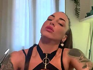 tattooed brunette masturbates with dildo in lingerie