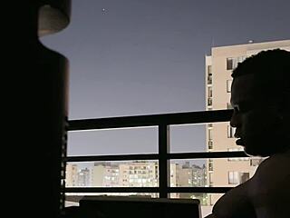 Amateur couple relaxing together on balcony