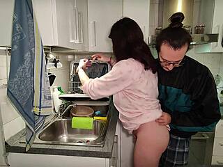 pregnant woman does tit wank in the kitchen after washing the dishes