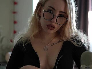 Tattooed nerdy girl in glasses teases her throat and uses asmr on herself