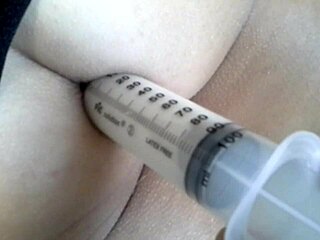 Kinky MILF gets punished with anal milk enema