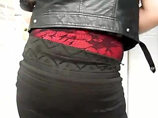 Mistress Lucy Diamond shows off her goddess booty in a red wetlook mini skirt