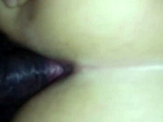 White woman shares intimate moments with black partner in brazilian setting.