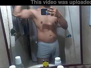 A man's sensual striptease and masturbation in a bathroom