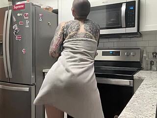 Twerking amateur dancer enjoying the beat bald pussy in the kitchen video