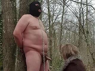 Whore submits in forest BDSM femdom scene