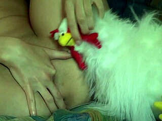 Anastasia, the brunette, engages in solo masturbation on the sofa.