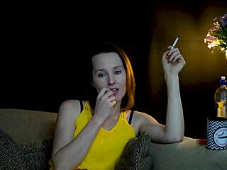A brunette is seductively staring at you while she sucks on a cigarette.