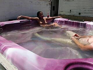 Skinny beauty enjoys hot tub time