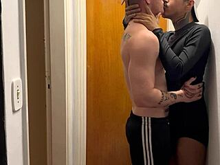 Young guys kissing get caught on building camera