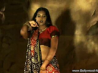 Brunette Indian woman undresses and teases in erotic striptease, clothes ripped for nude seduction.