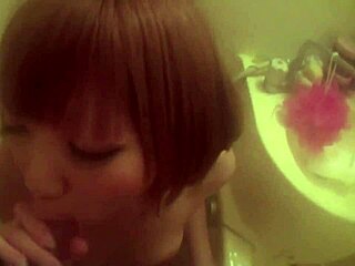 Big-boobed gyaru gives a shower blowjob in Japanese bathroom