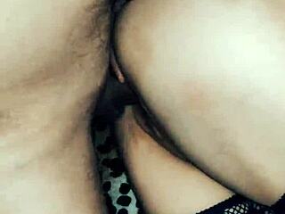 Beautiful wife in fishnet stockings shows off close-up