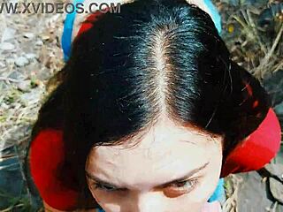 A couple risks a passionate blowjob in the open nature outdoors