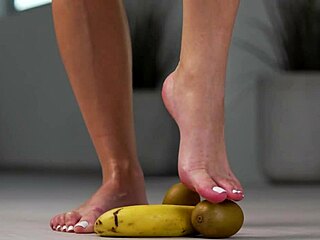 Watch this petite girl crush fruits with her high heels!