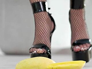 Watch this petite girl crush fruits with her high heels!