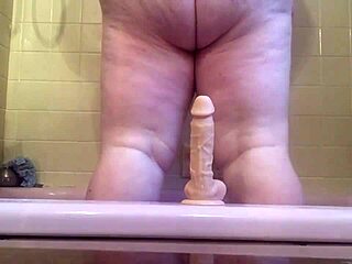 mwkm fucks fat dildo in bathtub