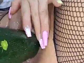 Hey, watch this hot Colombian shove a cucumber deep in her wet vagina