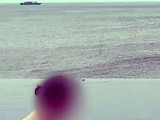 Stunning Asian college princess with ponytail shows off legs at infinity pool. Her small waist and beautiful feet shine by the water.