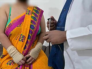 The doctor is checking the telugu aunty's boobs in the hospital with the nurse watching this indian patient scene.