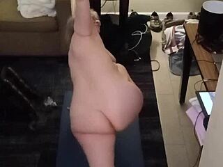 Mature MILF does naked yoga with big natural tits.