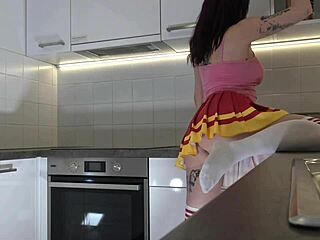 Redhead Cheerleader Shows Panties In Kitchen