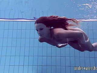 Lucy strips off bikini in pool underwater