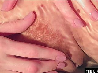 Dripping wet beauty relaxes in the bathtub