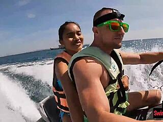 Asian girlfriend gives a blowjob in public on a jetski