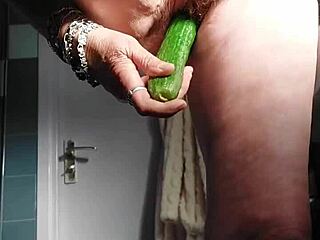 German granny intensely fucks pussy with cucumber
