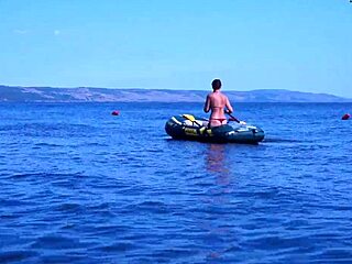 mature babe lounges in bikini on volga river boat ride