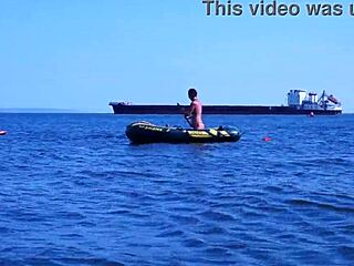 mature babe lounges in bikini on volga river boat ride