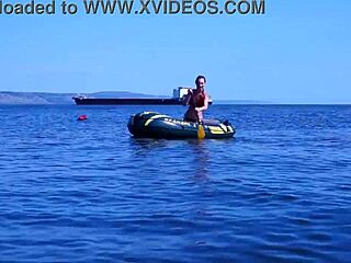 mature babe lounges in bikini on volga river boat ride