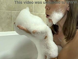 Brunette mature sings naked in steamy bathroom bath