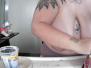 latina housewife flashes her saggy big natural tits while doing dishes at home