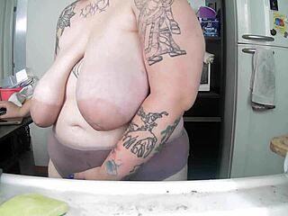 latina housewife flashes her saggy big natural tits while doing dishes at home