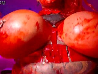 Vampire redhead babe with pierced nipples dances her huge fake tits wildly